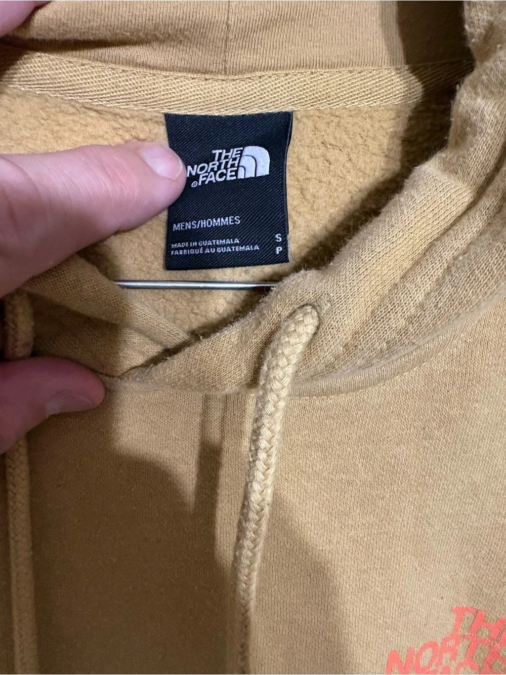 The North Face Mustard Pullover Hoodie with mountain outdoors scenery